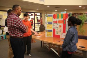 P-TECH students present their project to Dr. Parker