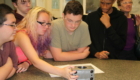 Students examining a piece of equipment at Simmons Machine Tool