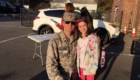 Dad in military uniform and young daughter