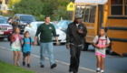 Dads walking into school with young children