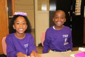 School 2 boy and girl smile for the camera