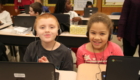 Students working on computer coding