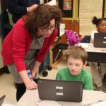 Students working on computer coding