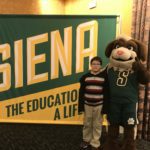 Student and siena mascot