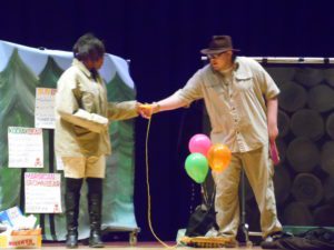 high school students on stage in costume