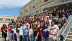 Group photo of seniors wearing their college shirts