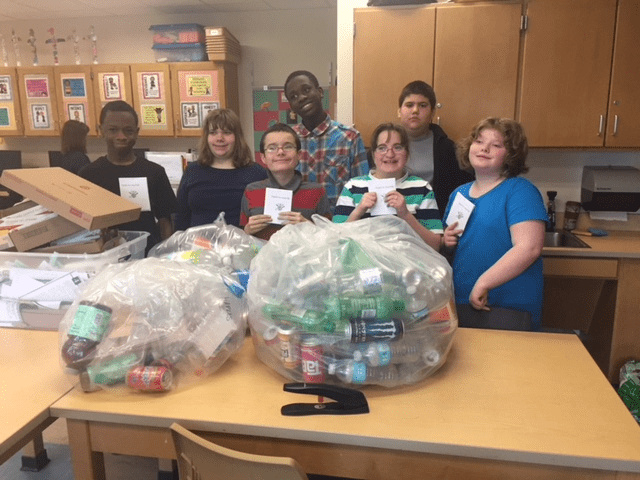 Students and their bag of recyclables