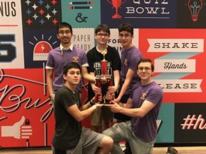 Troy High Quiz Bowl team holding their trophy