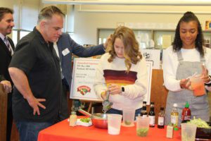 Chef Ric Orlando and students making a meal