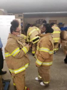 Female students in fire gear