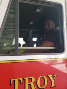 Student sitting in a firetruck