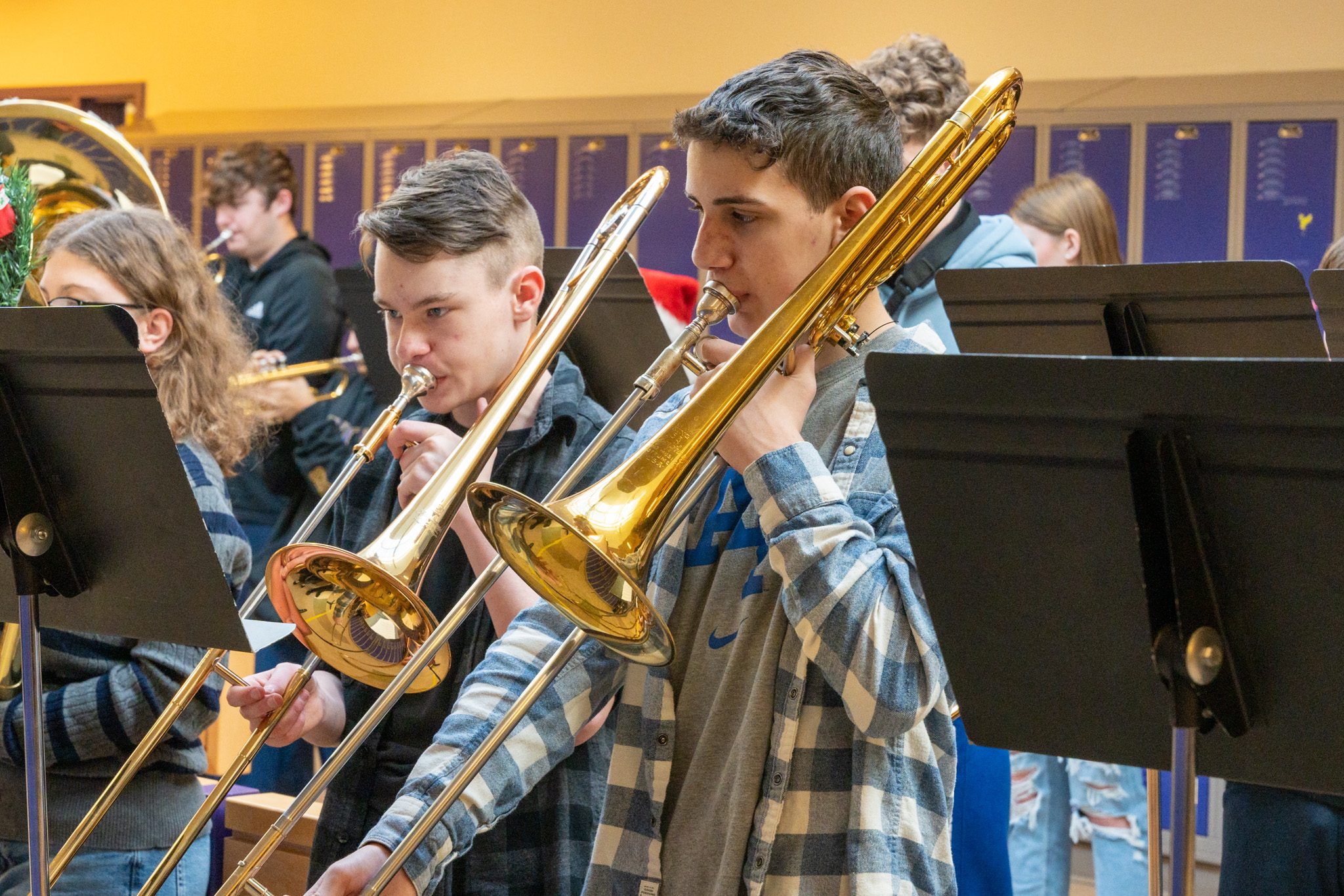 female student, masked, playing cymbols